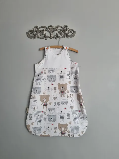 Summer Baby Sleep Sack in the Bear print, hanging on a wall hook